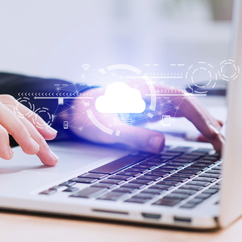 An image of a person working at a laptop with a cloud symbol | Cloud Services in Falkirk