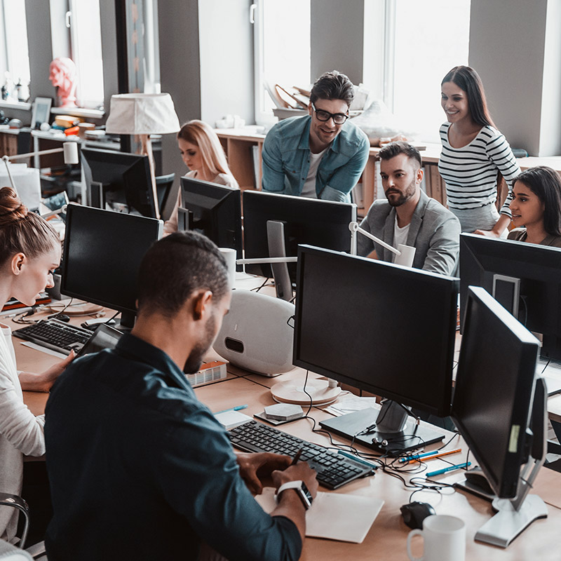 Am image of a group of people working together in an office | IT Helpdesk in Falkirk