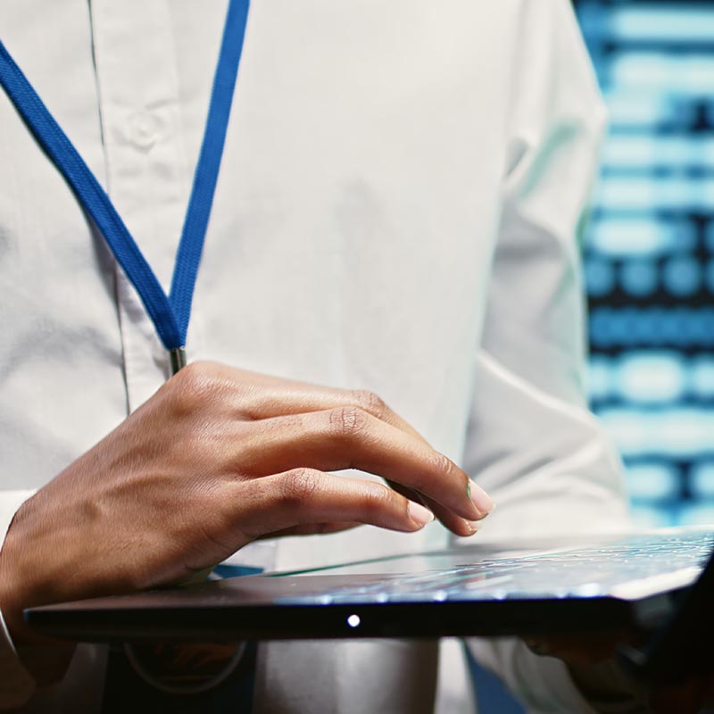 A close up image of a person holding a laptop | IT Emergency Support in Falkirk